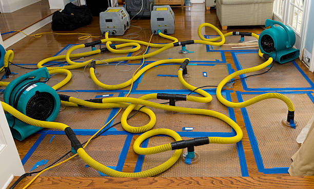 Professional Flood Damage Restoration technician working in Wyoming, WY